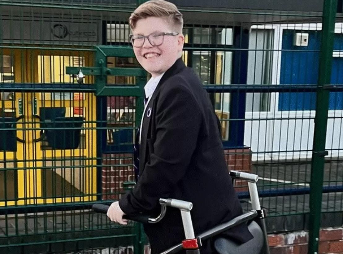 Tommy using his walking frame